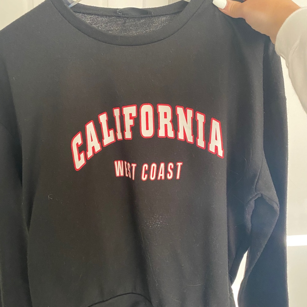 black crewneck, hardly worn